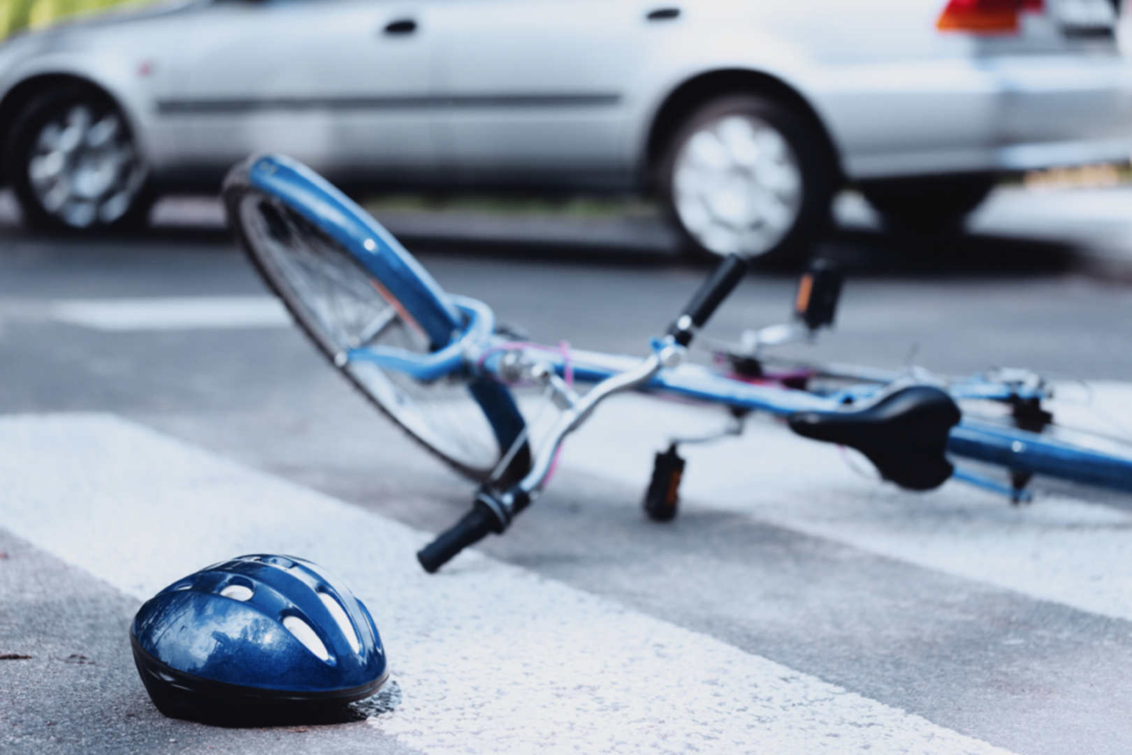 Helmet,And,Bike,Lying,On,The,Road,After,A,Car (Bike-accident)