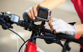 Cyclist Setting Camera on Bike - Why Bicyclists Should Ride With a Camera