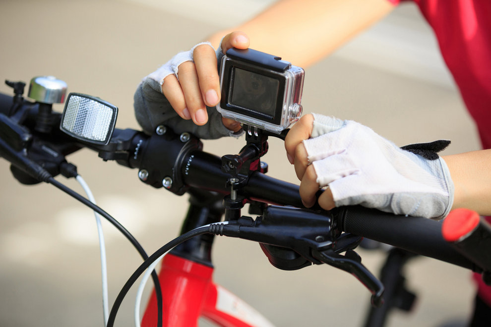 Cyclist Setting Camera on Bike - Why Bicyclists Should Ride With a Camera