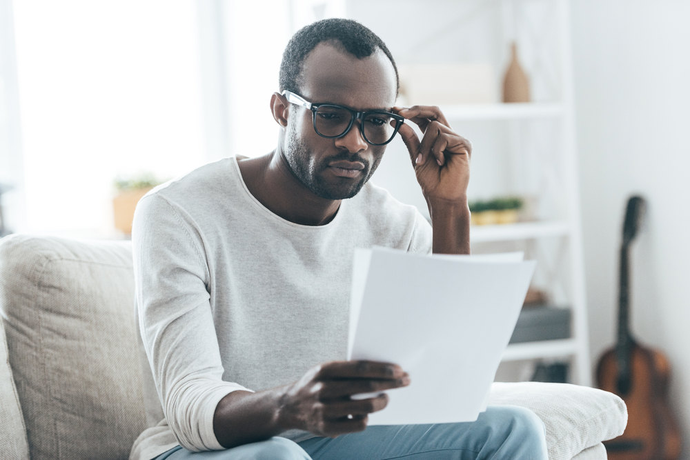 man reading reservation of rights letter