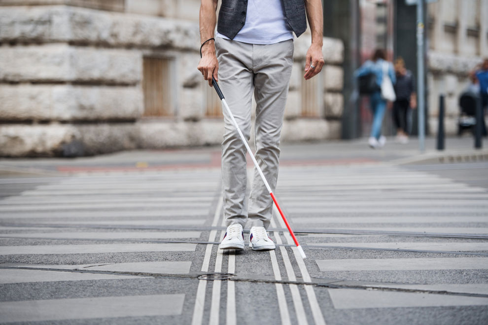 Blind man crossing street