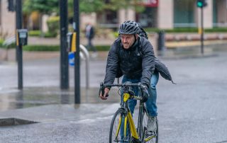 Man cycling in the rain