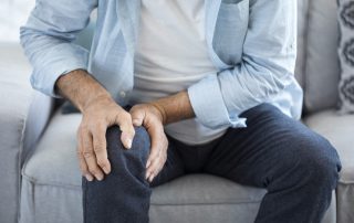 Man suffering from knee pain