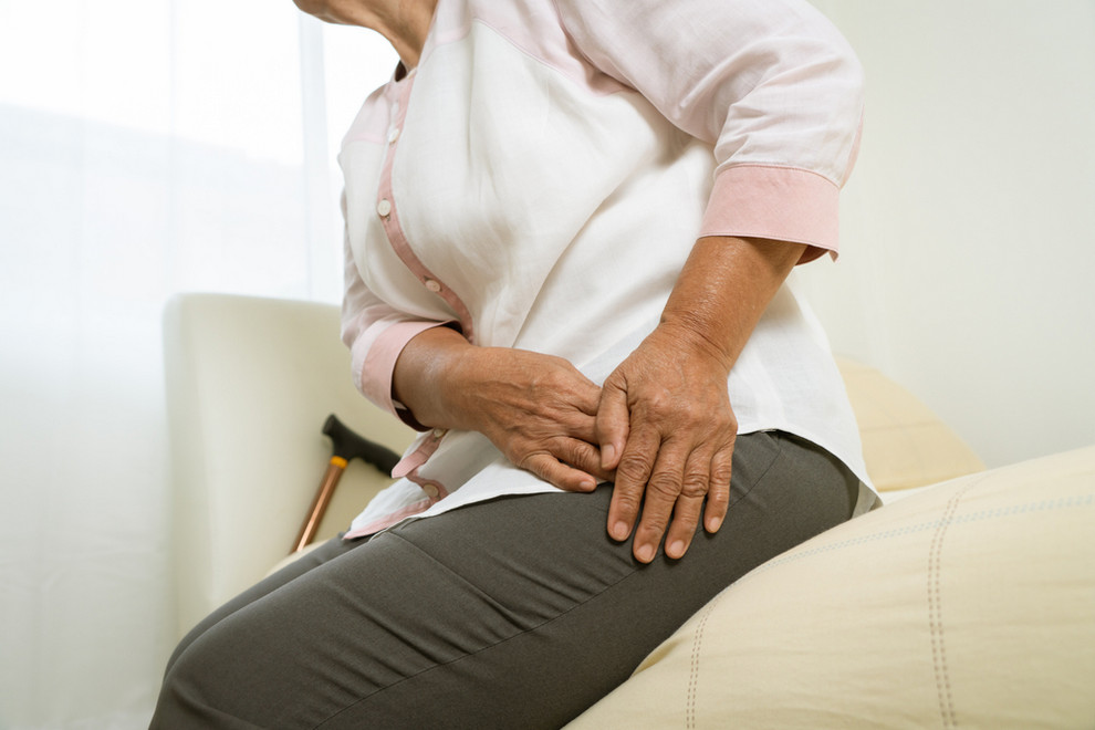 Woman with hip pain - Hip Disorders