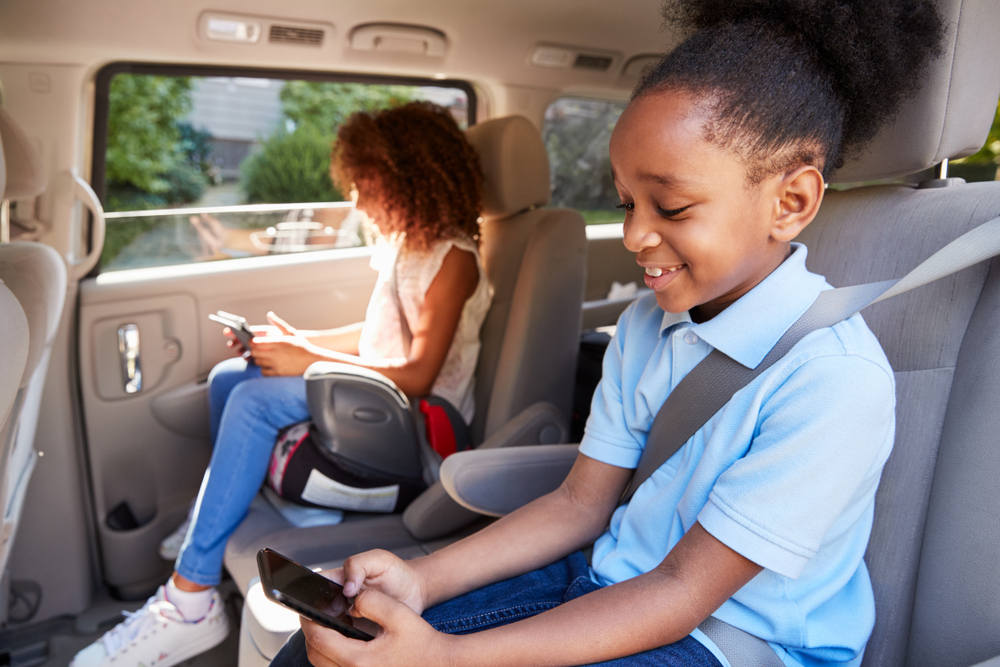 Kids on booster seat in car